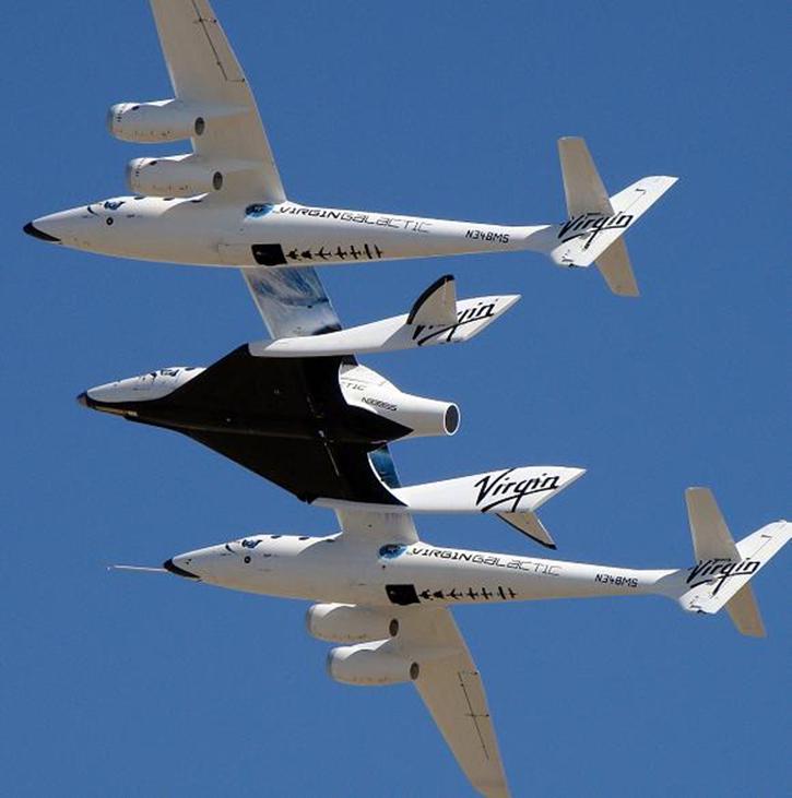The SpaceShipTwo craft takes to the air carried by its WhiteKnightTwo mothership. Credit: Virgin Galactic